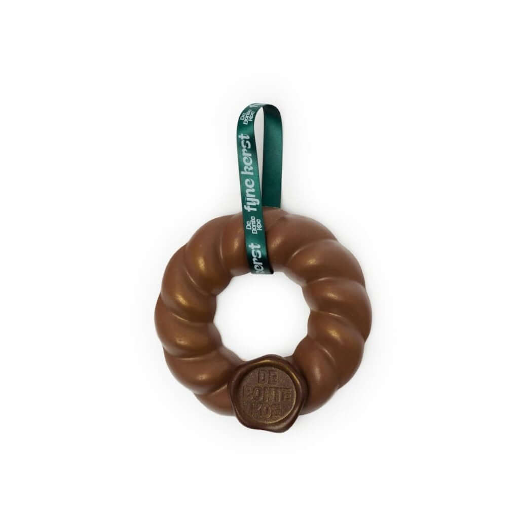 Feestelijke chocolade kerstkrans van De Bonte Koe, perfect voor de feestdagen.